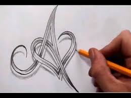 Letter j in cursive writing for wall hangings or craft projects. Tattoos With Hidden Initials Creating A Tribal Heart Tattoo Design With Numbers Videos Ccoli Tattoo Lettering Tattoo Lettering Fonts Lettering Design