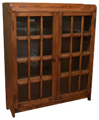 This bookshelf features a tall rectangular shape with a walnut frame. Mission Oak Bookcase With 2 Glass Doors Craftsman Bookcases By Crafters And Weavers