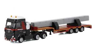 A 3 axle flatbed truck features no sides or top and are generally used for carrying bulk freight or heavy equipment. Trucks Tematoys 900036 Mammoet Mercedes Benz Actros Bigspace 6x4 With 3 Axle Lowboy Trailer And 2 Beams