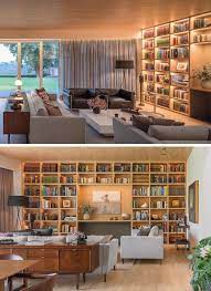 A Full Wall Of Shelving With Hidden Lighting Is A Bright Idea For This Living Room Home Library Rooms Bookshelves In Living Room Built In Shelves Living Room