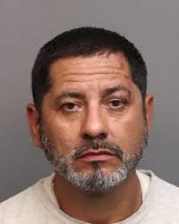 A man pushing a shopping cart was hit by a car and then the car left the  scene