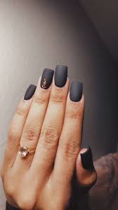 Matte Black And Gold Acrylic Nails Matte Black Acrylic Nails With Rose Gold Gems And A Rose Quartz Engagement Ring Matte Black Nails Black Acrylic Nails Engagement Nails