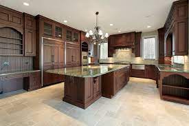 Personally i would not put laminate flooring in a kitchen or a bathroom, and the manufacturers usually recommend against using it in areas where there may be water. 43 Kitchens With Extensive Dark Wood Throughout Home Stratosphere