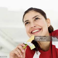 82 Woman Holding Candy Bar Stock Photos, High-Res Pictures, and Images