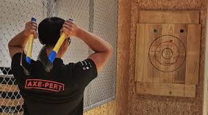 Throwers score points for each axe that sticks the target. Axe Factor Axe Throwing Di Singapura