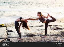 Beyond being fun, partner postures can help strengthen your body, improve your flexibility, and enhance relaxation. Two Girls On Beach Image Photo Free Trial Bigstock