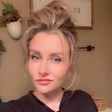 The criminal complaint states Kelly and her husband had gotten into an  argument about her kissing another man.