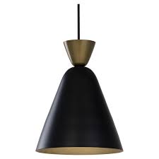 The shade is made from metal, and has a matte finish on the outside and a glossy one on the interior for some contrast. Sunpan Danica 10 Modern Metal Cone Shaped Pendant Light In Black Gold 105789