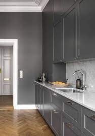 Darker tones of grey and blue won't close the. Cozy Dark Grey Kitchen Via Coco Lapine Design Blog Grey Kitchen Designs Kitchen Remodel Small Kitchen Remodel Layout