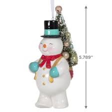 Most are made of some form of plastic or resin. Vintage Snowman With Tree Porcelain Ornament Keepsake Ornaments Hallmark