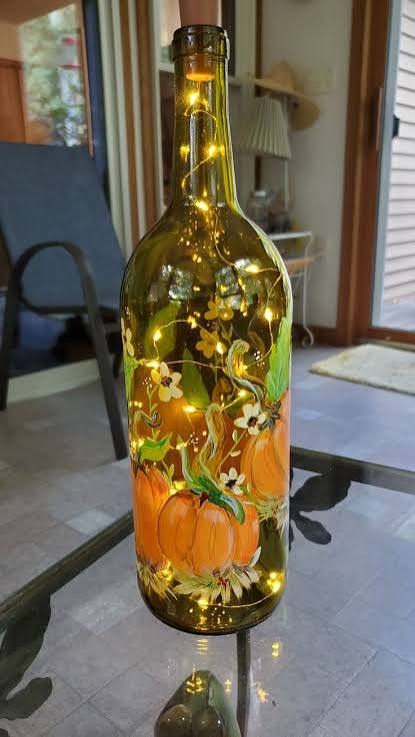 DIY Lighted Wine Bottle | Fall wine bottle crafts, Fall bottle painting ideas, Painted wine bottles