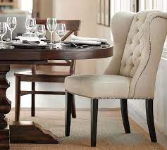 Ours are designed with the right proportions to be comfortable to sit in until dessert. Thayer Tufted Wingback Dining Chair Pottery Barn