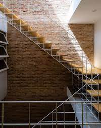 White Grid Inserted Into Vietnamese Townhouse By Block Architects Stairs Architecture Staircase Design Architecture