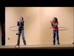 sisters hula hooping to the cha cha slide cha cha slide hula hoop cha cha