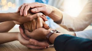 Hands together in a supportive gesture, representing IVF and fertility support