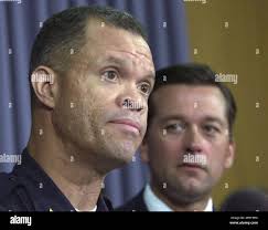 Richmond police chief Andre Parker, left, answers reporters questions as  Virginia Attorney General Jerry Kilgore, right, listens during a press  conference at the Capitol in Richmond, Va., Monday July 19, 2004. Parker