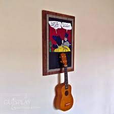 Especially for string players, where a basic acoustic guitar suddenly turns into an electric guitar, an electric bass, a ukulele, or a mandolin. Batman Ukulele Meme Custom Language Made To Order I Like You Tiny Guitar Mate It S A Ukulele German Guitar Wall Hanger Wall Hanger Guitar Display