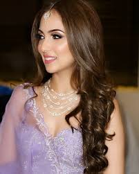 Take long pieces of hair from behind your ears, braid them, and then wrap them around the top of your head. Wedding Hairstyle Ideas For Mehndi Sangeet Wedding Reception Bridal Look Wedding Blog