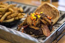 The Works Is Making Reese Stuffed Burgers Topped With Reese Niagara Now