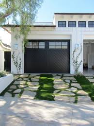 11 Ways To Make A Cookie Cutter Suburban House Stand Out Garage Door Design Suburban House Garden In The Woods