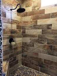 Wood Look Tile Shower With Pebble Floor Farmhouse Shower Rustic Bathroom Designs Rustic Bathrooms
