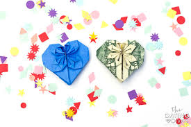 Folding dollar bills into hearts. Picture Guide For How To Make An Origami Heart The Dating Divas