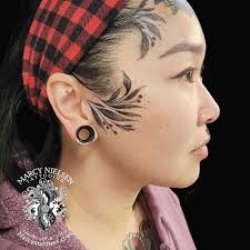 Marcy Nielsen Tattooing added a...