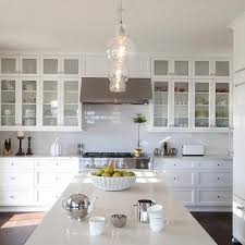 Providing a neutral backdrop, white kitchen cabinets can be left alone or dressed up with colorful simple update. Double Stacked Upper Cabinets Design Ideas
