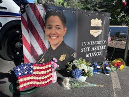 A memorial is starting to grow as people pay their respects to Sgt. Ashley  Munoz who was sadly killed in a crash while heading home from vacation with  her wife, Sgt. Diana