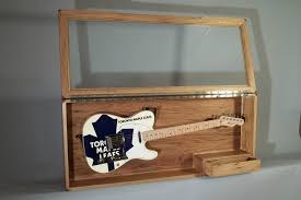 On the back of the guitar display case, attach framing eyes 1 inch from either edge around 6 inches from the top. Guitar Display Case By Ken Dixon Lumberjocks Com Woodworking Community