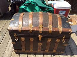 The trunk is made of camphorwood and has a hinged top that opens to reveal a small compartment to the left there are brass bound decorations to the piece and features a plaque to the center of the lid. Antique Trunks Everything You Need To Know About Collecting These Beautiful Antiques Dusty Old Thing