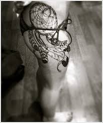 Our next tattoo is a heart shaped dream catcher with a pink heart in the center. Side Thigh Dreamcatcher Tattoo
