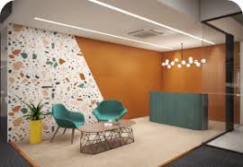 Laptop, coffee cup, business drawings on table. Ahmedabad Based Corporate Office Interior Designing Services Phi Design