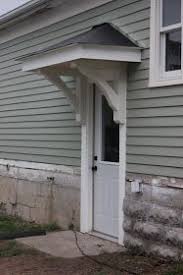 Building The Back Door Overhang Porch Roof Design Garage Door Design Door Overhang