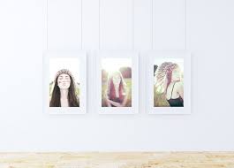 This Free Mockup Features 3 Hanging Picture Frames Against A White Wall With A Wooden Floor