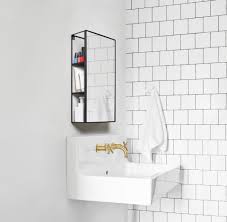 The hub mirror is an oversized glass mirror with a rubber rim. Cubiko Mirror Black Umbra Umbra 1009654 040