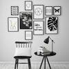 Black walls contrast starkly with a crisp white ceiling and white bedding. 1
