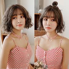 It frames your face gorgeously and makes your cheeks look slimmer, making it a great choice for girls with round faces. Wig Female Short Hair Short Curls Corn Hot Bobo Korean Wave Head Handsome Net Red Round Face Instant Noodles Curls Pullover