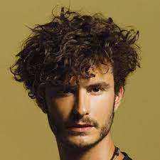 Guy With Messy Side Brushed With Beard And Messy Sideburns Curly Hair Styles Curly Hair Men Mens Hairstyles
