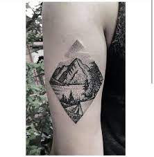 In this onehowto article we're going to explain the different meanings of diamond tattoos, what they symbolize and stand for. Outstanding Dotwork Mountains And Trees In Diamond Shape Tattoo On Leg By Gillian Allport