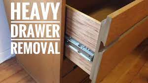 Push down on the sides of the drawer so that the back end lifts slightly. Lateral File Cabinet Drawer Removal Side Glide Drawer Removal Youtube