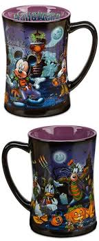 Enjoy a warm cup of coffee on a cool october day with these pumpkin shaped ceramic mugs with halloween themed decorations. Happy Halloween Disney Parks Halloween Themed Haunted House Coffee Mug Features Goofy Donald Duck Mickey And Minnie Mou Mugs Disney Coffee Mugs Disney Mugs