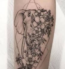 Pin By Andrea Hernandez On Don T Mind If I Tattoo Elephant Tattoo Design Small Inspirational Tattoos Flower Thigh Tattoos