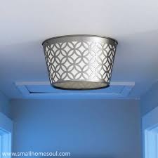 For a complete update, replace the sink, countertop and faucet the same time as the vanity cabinet. Boob Light Makeover Diy Ceiling Light Update Girl Just Diy