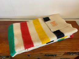 The hudson's bay point blanket is a wool blanket with a series of stripes and points (markers on cloth) first made for the hudson's bay company (hbc) in 1779. Sold Price Vintage Hudson Bay Four Point Blanket Invalid Date Pdt