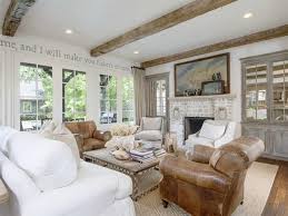 This tufted ottoman holds the family's treasures, showing off their personalities and style. French Country Living Rooms