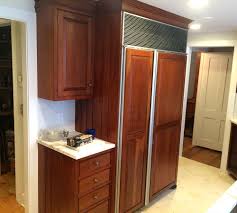 Protect areas next to the cabinets with painter's tape. Cherry Cabinets Refinishing Project Gallery Classic Refinishers