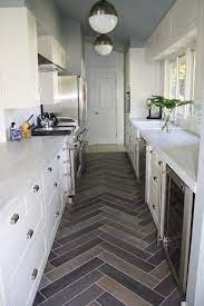 Whether it's in a rental apartment or something to call your own, you might have a foot of counter space, a few kitchen cabinets, and maybe a wall to work with, if you're lucky. Tile Pattern Small Galley Kitchens Kitchen Remodel Small Small Galley Kitchen