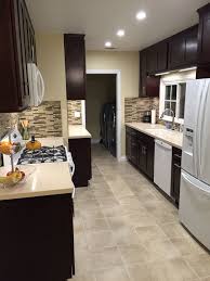 Get inspiration for storage, materials and finishes. Dark Brown Kitchen Cabinets With White Appliances Novocom Top