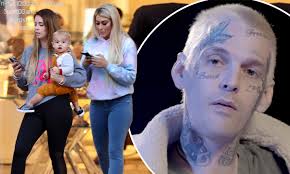 Aaron Carter's fiancée Melanie Martin steps out with son